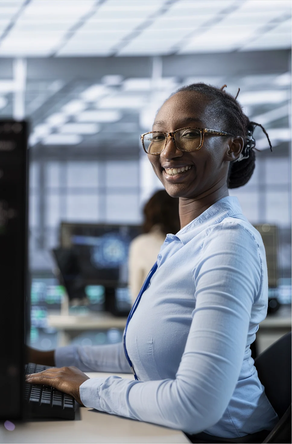 Payroll administrator working at a computer